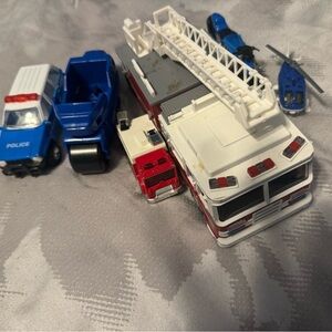 Lot of Fire and Police trucks and vehicles, totall six! Including a helicopter!